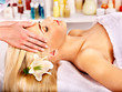 Photo: Woman getting facial massage . Woman getting facial massage .