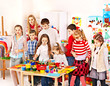 Child painting at art school.