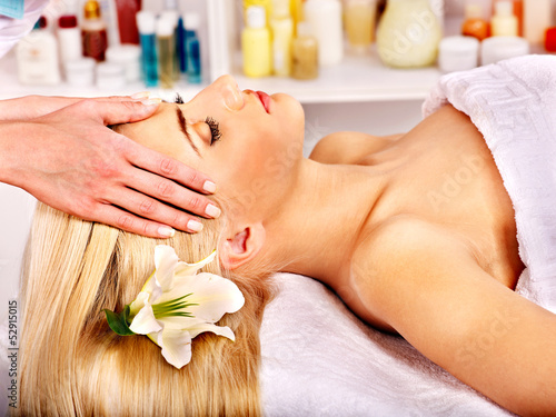 Photo: Woman getting facial massage . Woman getting facial massage .