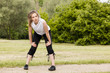 Woman jogging in the park in summer