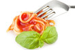 fork with spaghetti sauce and basil on white