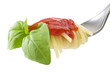 fork with spaghetti sauce and basil on white