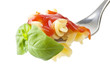 fork with fusilli sauce and basil on white