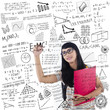 Asian female student write on whiteboard