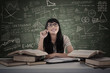 Beautiful female student study in class