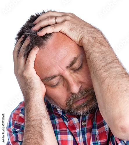 Photo: Middle age man suffering from a headache Middle age man suffering from a headache