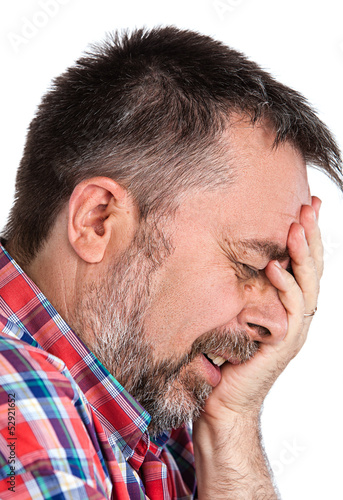 Photo: Elderly man suffering from a headache Elderly man suffering from a headache
