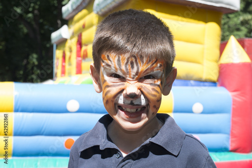 Photo: Child with painted face Child with painted face