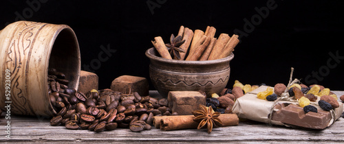 Photo: Chocolate bar and spices on wooden table Chocolate bar and spices on wooden table