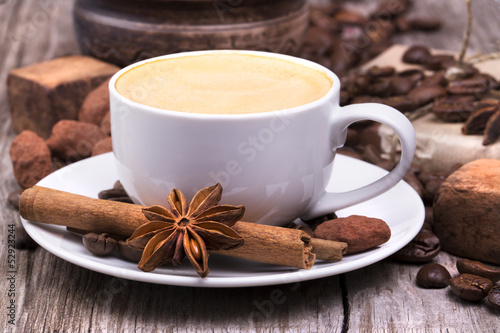 Photo: white cup of espresso full of coffee beans white cup of espresso full of coffee beans