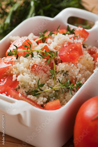 Photo: Tasty couscous with herbs ant fresh tomato Tasty couscous with herbs ant fresh tomato