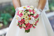 Wedding bouquet in hands of the bride
