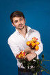 Man with bouquet of red roses