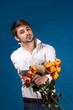 Man with bouquet of red roses