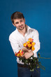 Man with bouquet of red roses