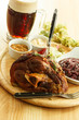 eisbein with braised cabbage, mashed potato, and beer