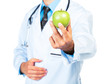 Doctor's hand holding a fresh green apple close-up