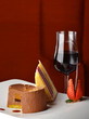 Chocolate and berries cake with glass of dessert wine