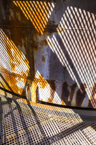 Photo: pattern of rusty chimney with reflection of son pattern of rusty chimney with reflection of son