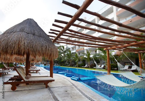 Photo: Chaise-long near swimming pool. Chaise-long near swimming pool.