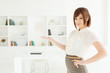 Beautiful young businesswoman working in office