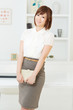Beautiful young businesswoman working in office
