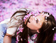 Women showered with pink petals