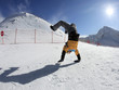 Snowboarder standing on hands