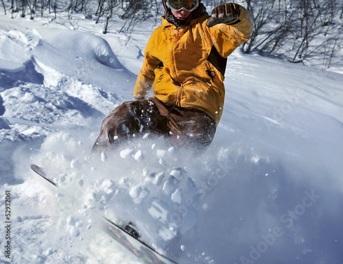 Photo: Snowboarder moving down Snowboarder moving down