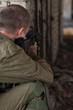 aim at the sight of a man in a ruined building machine