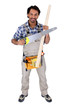 Photo: Worker holding a saw and a piece of wood Worker holding a saw and a piece of wood