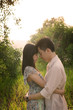 Photo: asian chinese romantic couple in the park during sunrise asian chinese romantic couple in the park during sunrise