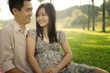Photo: asian chinese romantic couple in the park during sunrise asian chinese romantic couple in the park during sunrise