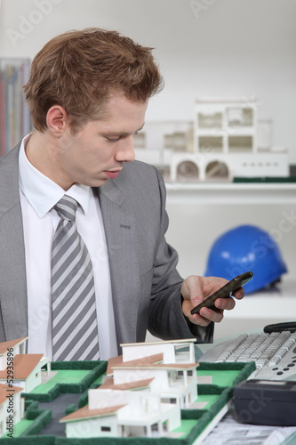 Photo: real estate businessman in his office real estate businessman in his office