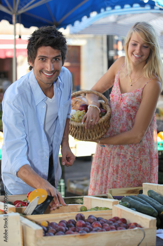 Photo: Couple at a market stall Couple at a market stall