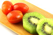 Kiwifruit slices into pieces and three Tomato.