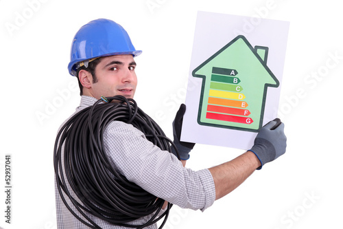 Photo: electrician holding an energy consumption label electrician holding an energy consumption label