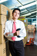 Photo: Young Man in a warehouse with Scanner Young Man in a warehouse with Scanner