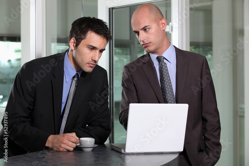 Photo: young businessman looking very sad young businessman looking very sad