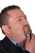 Foto: Man scratching his chin Man scratching his chin