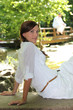 Photo: Woman sat in garden Woman sat in garden