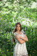 Beautiful girl among the meadow flowers
