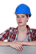 Photo: Female mason stood by unfinished wall Female mason stood by unfinished wall