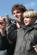 Foto: Little boy holding model plane Little boy holding model plane