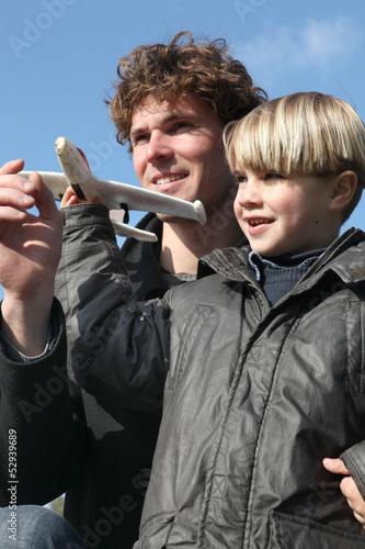 Photo: Little boy holding model plane Little boy holding model plane