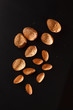 almond on black background