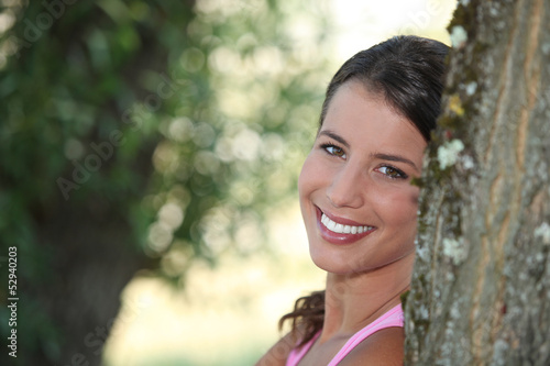 Photo: Girl relaxing under tree Girl relaxing under tree