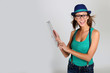 Girl with hat websurfing with tablet
