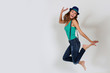 Funny brunette girl jumping up in the air