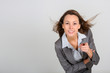 Successful business girl leaning towards camera